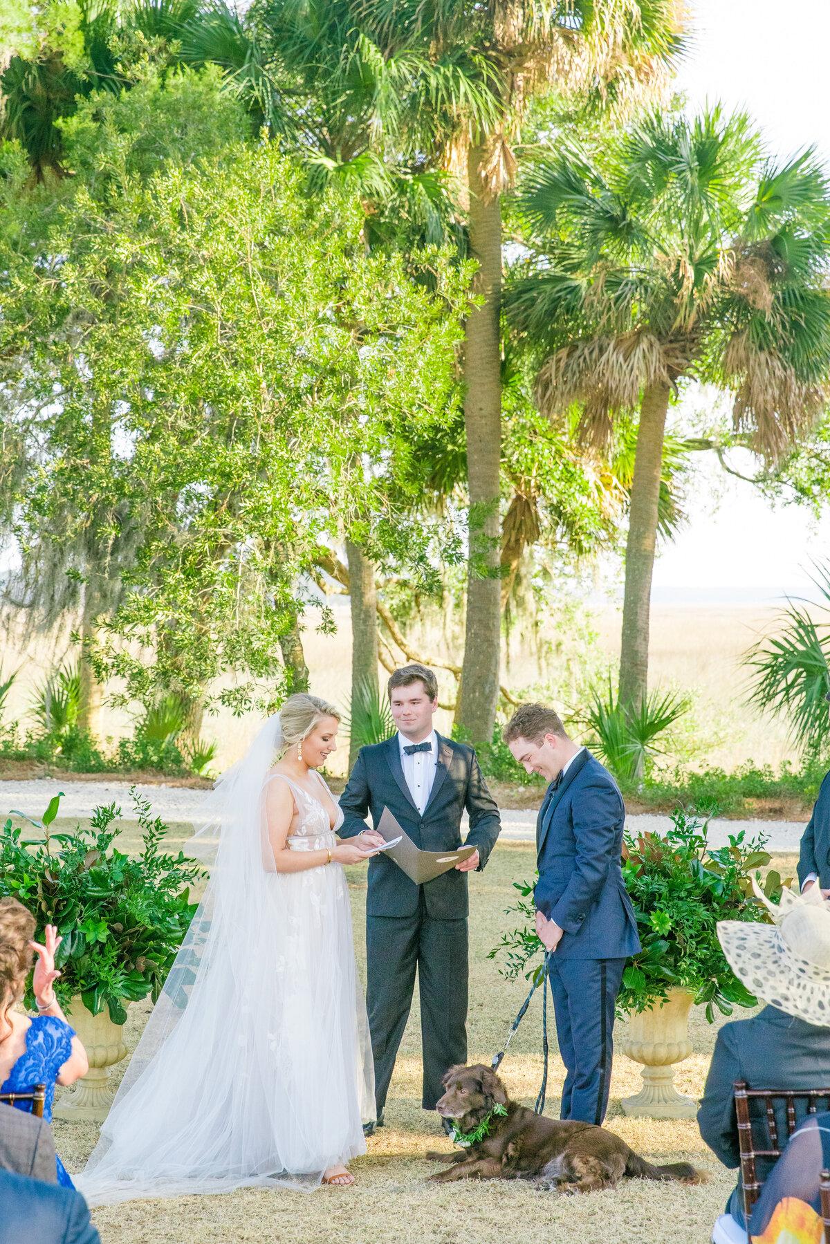 Wedding ceremony with dog at Palmetto Bluff near Charleston, South Carolina. Photographed by destination and Charleston wedding photographer Dana Cubbage.