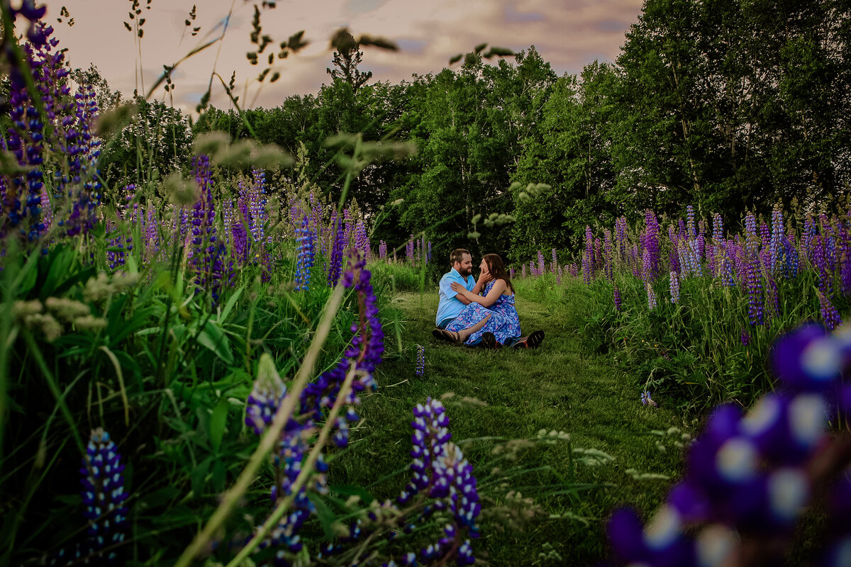 Bride and Groom laying together on dock | Taken By Maine Photographer