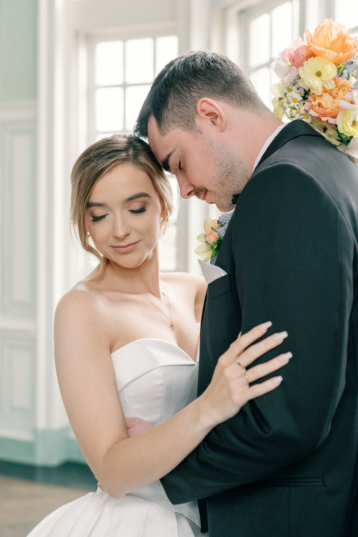 Estate at River Run Wedding in Maidens, VA | Wedding Photographer in Richmond | groom nuzzling into his bride in the ballroom of the Estate at River Run