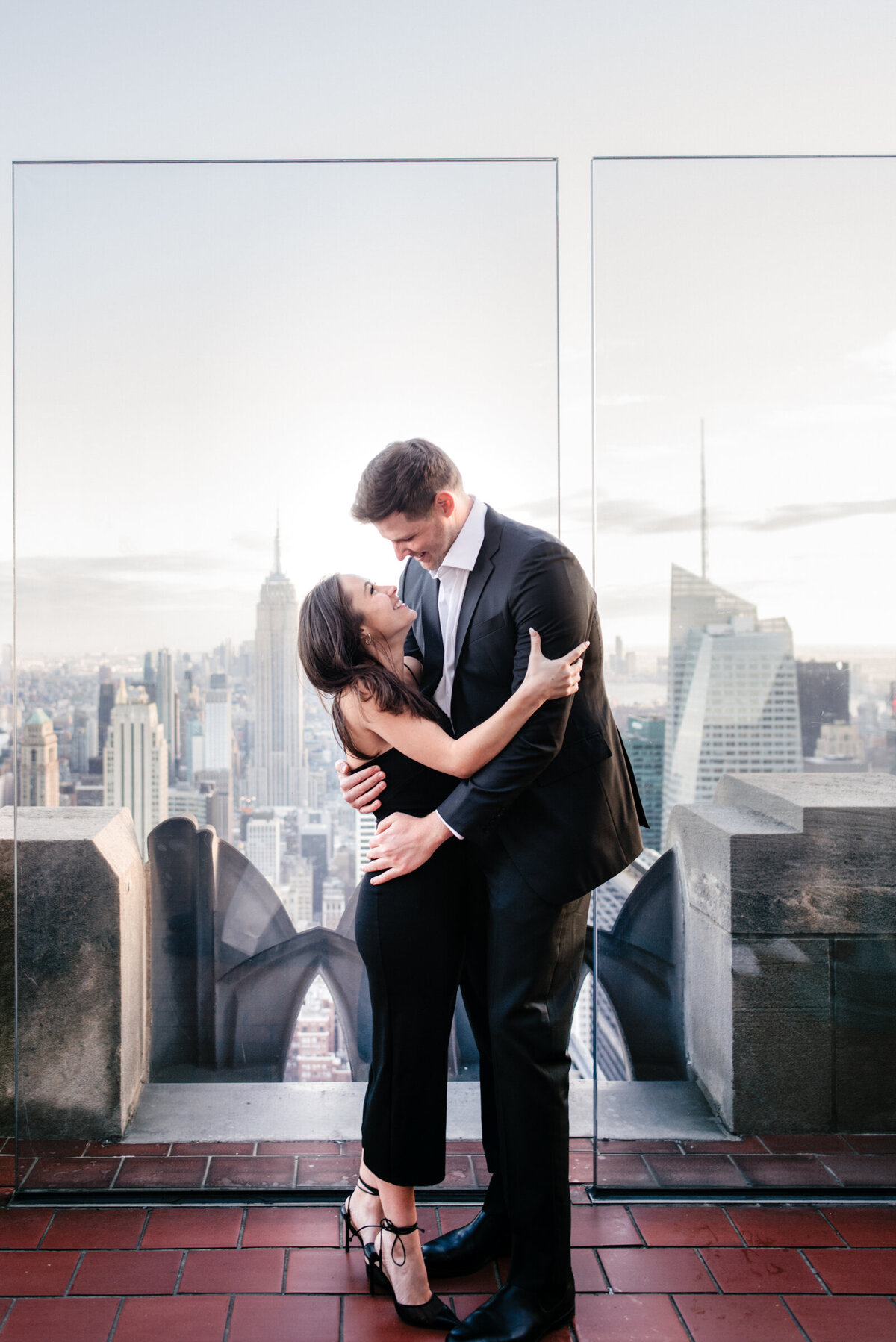 couple posing at Top of the Rock in New York City
