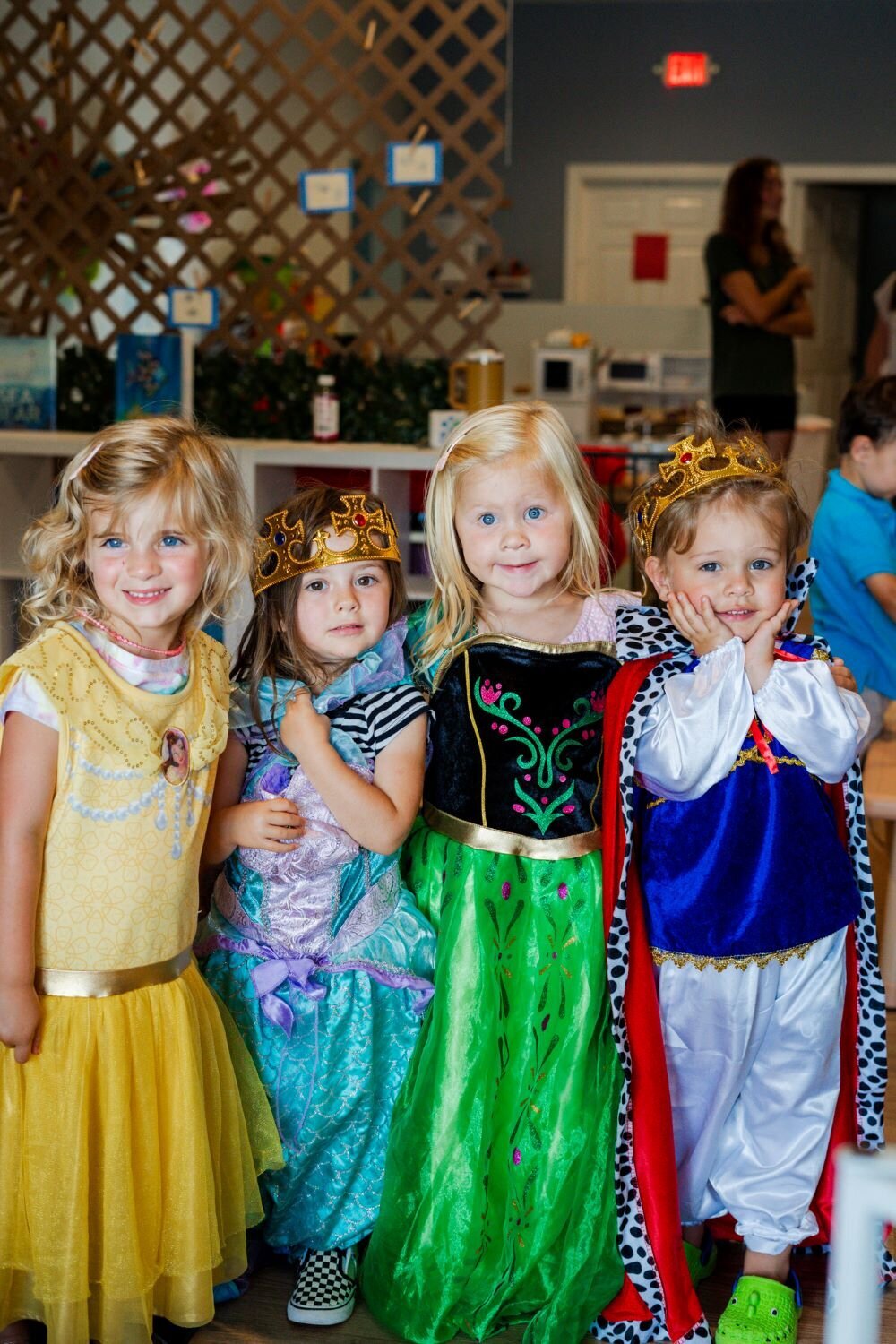 Four young students dressed up as princesses and a prince at The Nest, a preschool and learning center in Surf City, North Carolina