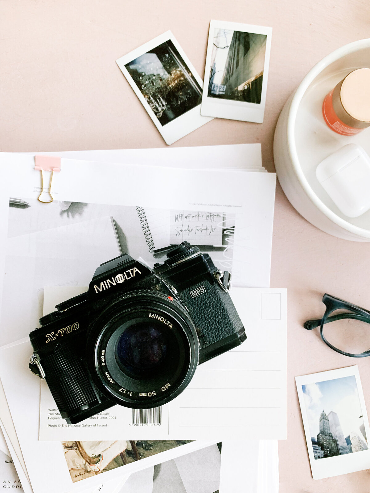 camera glasses and papers