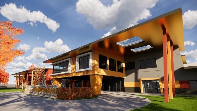 Modern exterior view of St Gabriel School in Castle Hill, with golden-yellow architectural accents.