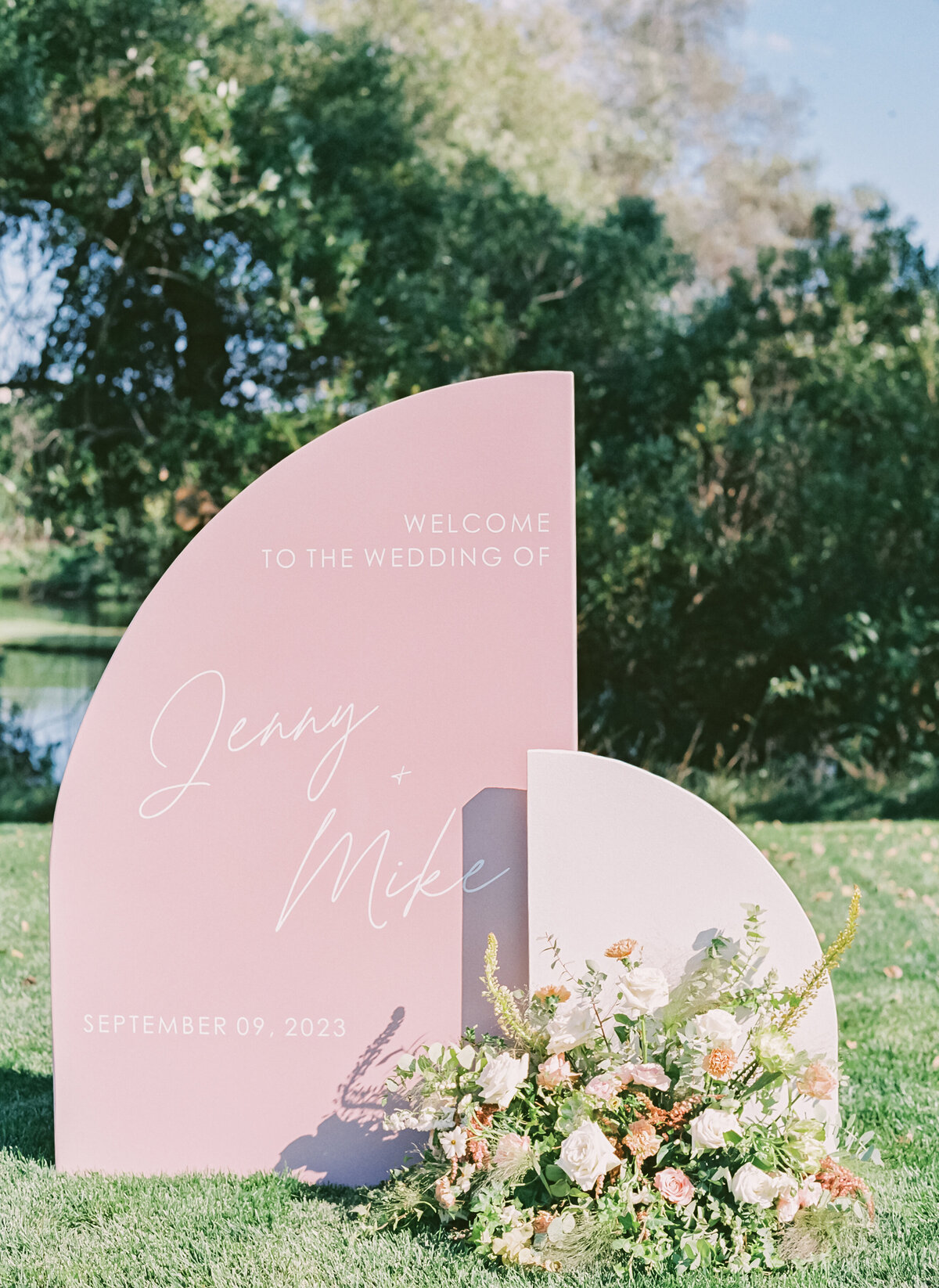 wedding welcome sign with luxury floral arrangement