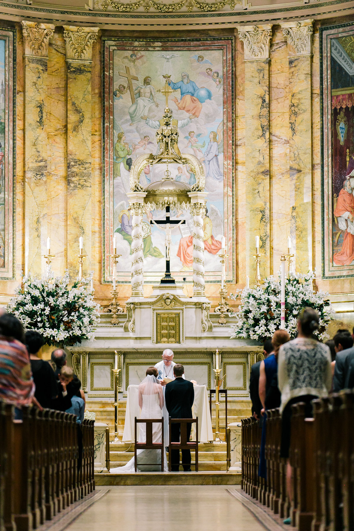 Bride and groom getting married at St. Ignacious Loyola Church NYC