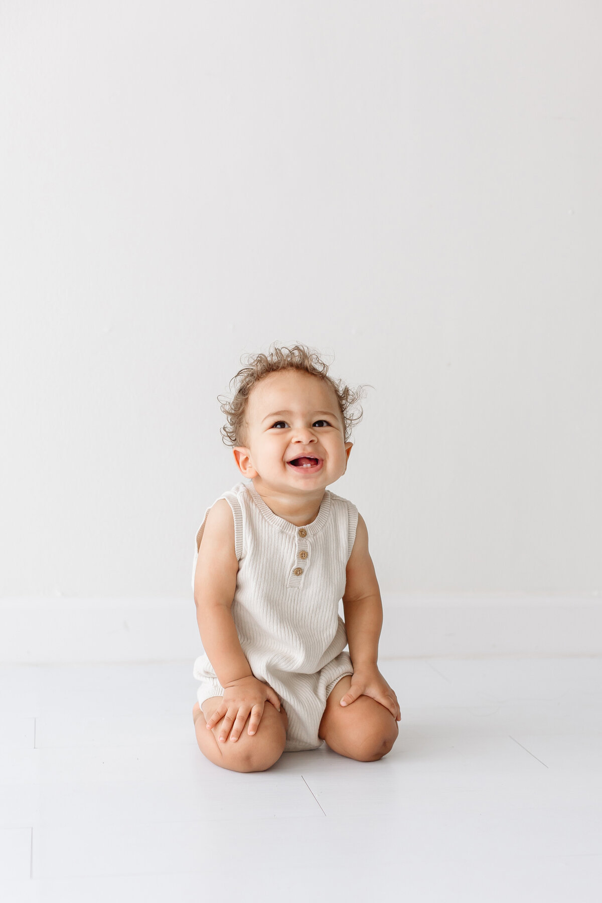 happy toddler on his knees