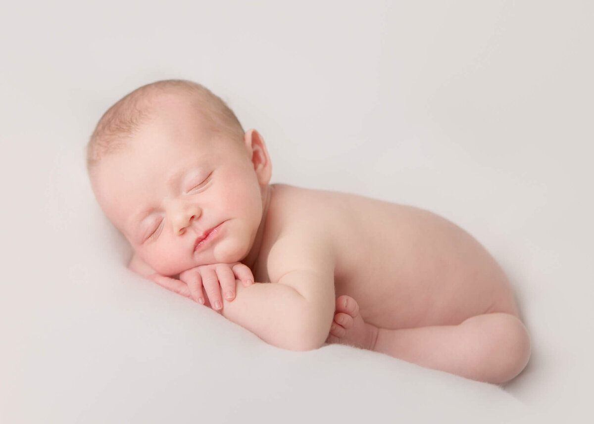 Girl laying on her arms asleep at her photoshoot in Calabasas by Los Angeles newborn photographer