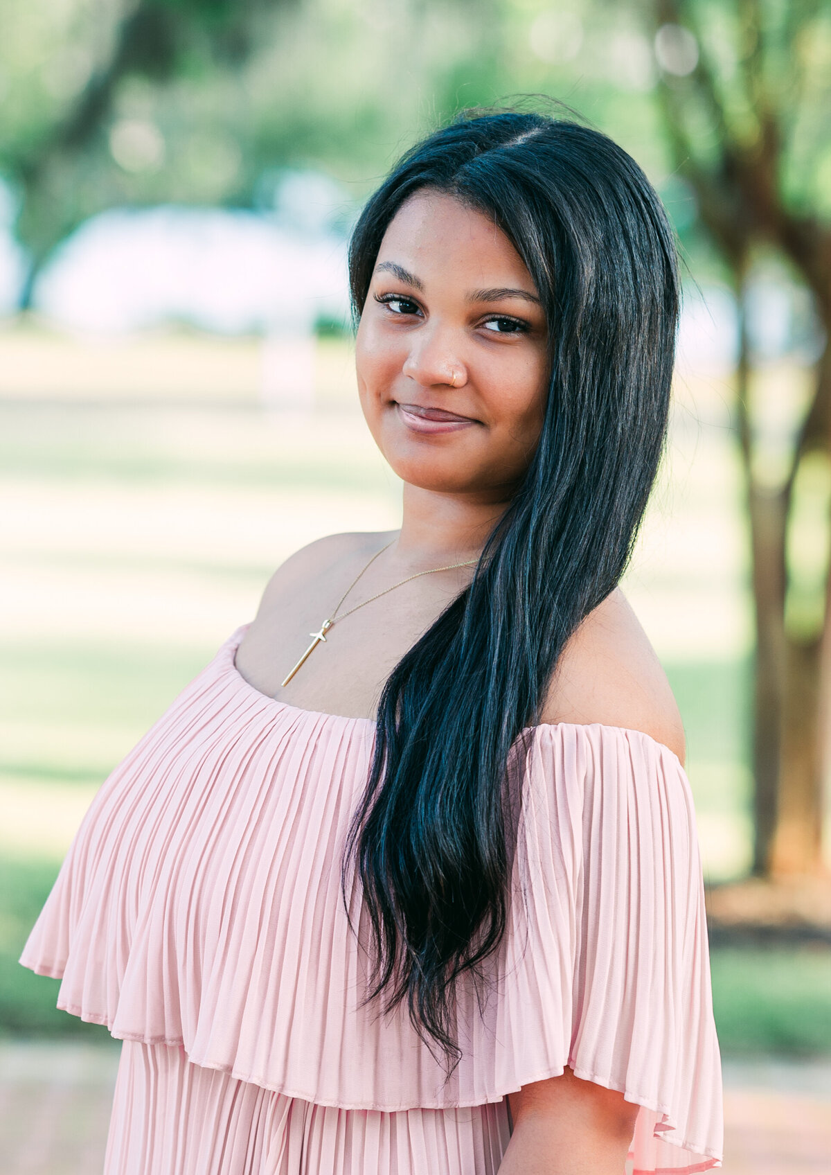 Beautiful senior portrait of young lady in pink. Photography by LV Hughes. Serving Bainbridge, Tallahassee, & surrounding areas. 
