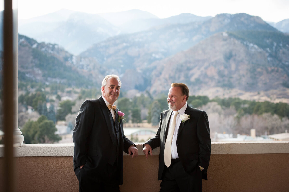 Groom standing next to his best man after getting ready for the ceremony