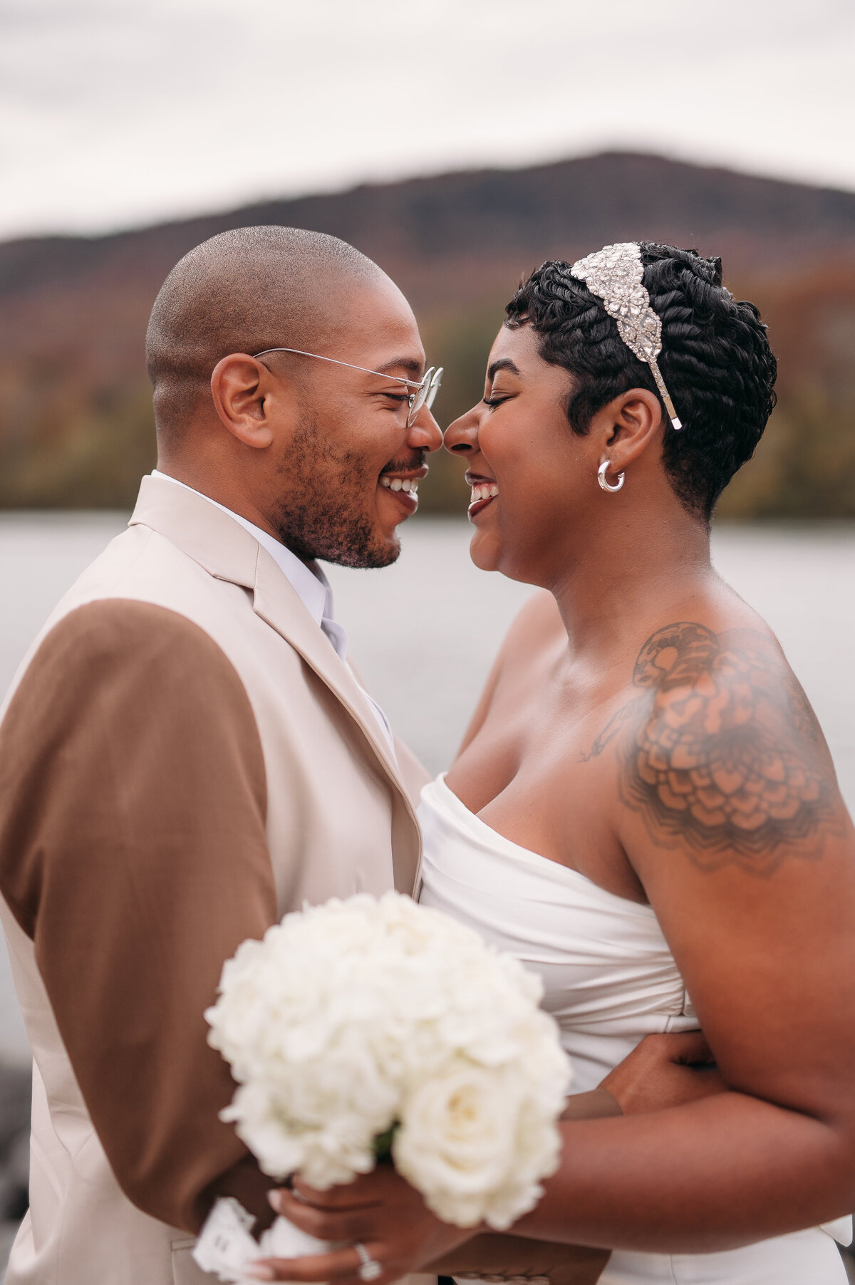 Bride and groom smile at each other during their vows in the Tennessee mountains