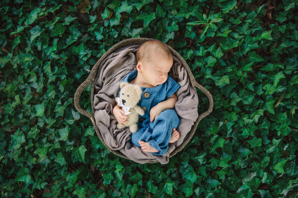baby sleeps for photos outside during newborn photography session in New Jersey