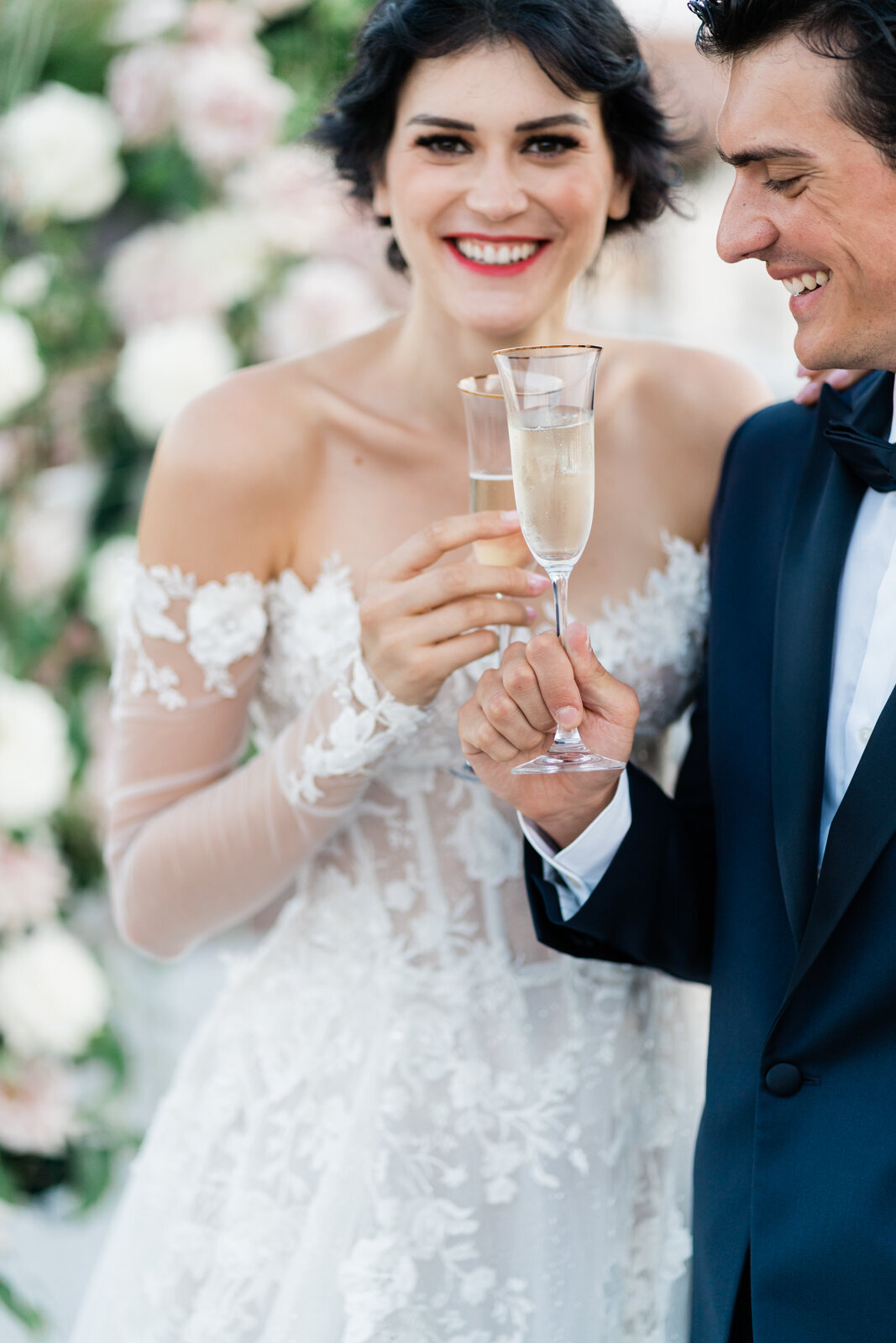 close up of a bride and groom having a toast