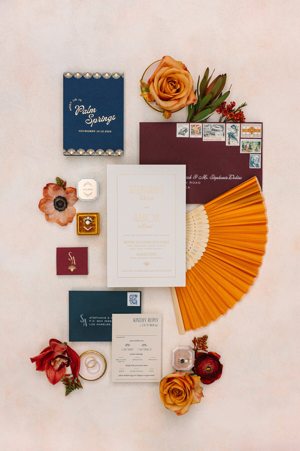 Detail shot of wedding rings on colorful invitation card