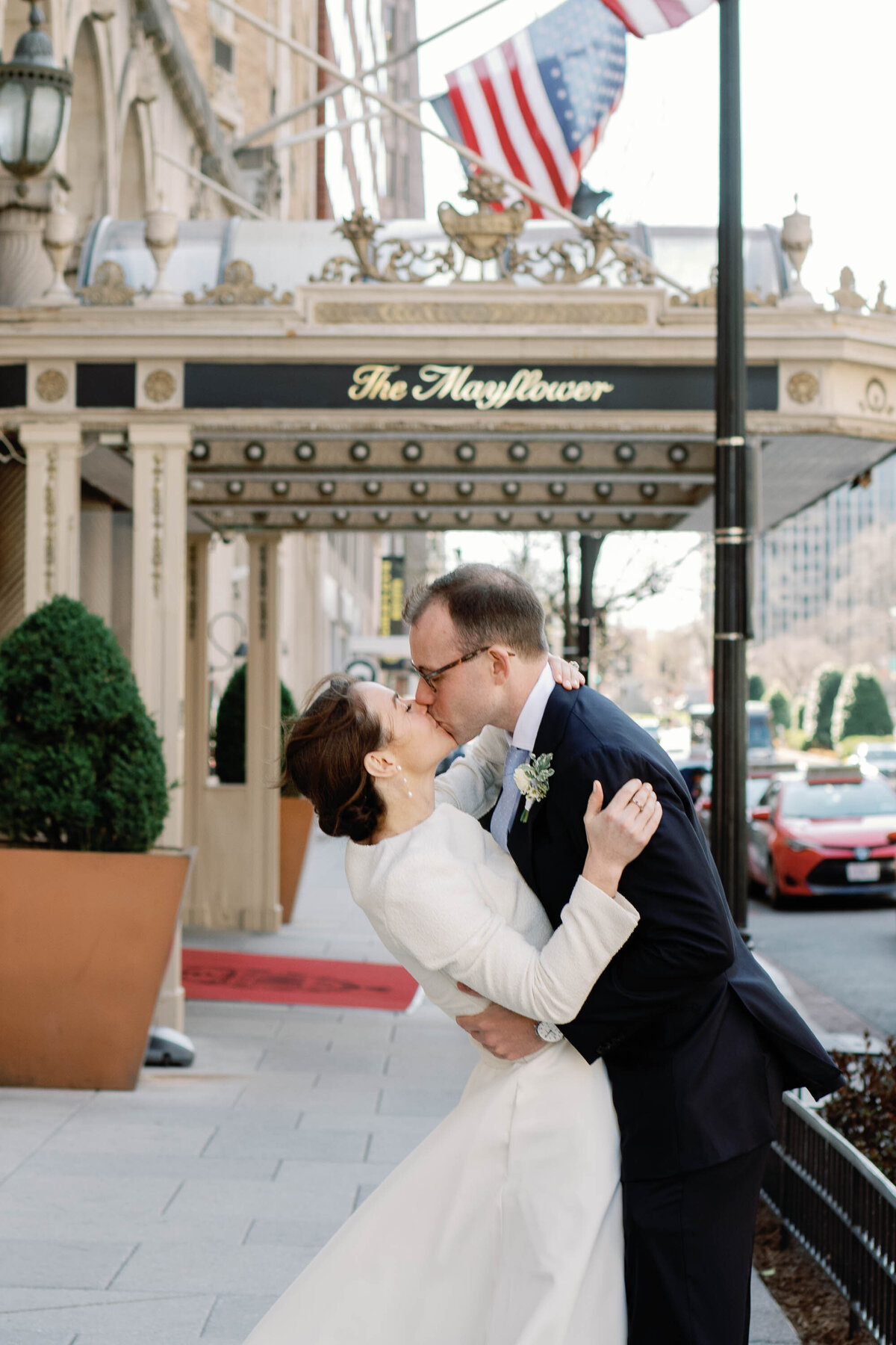 bride and groom kiss at mayflower hotel in washington dc wedding