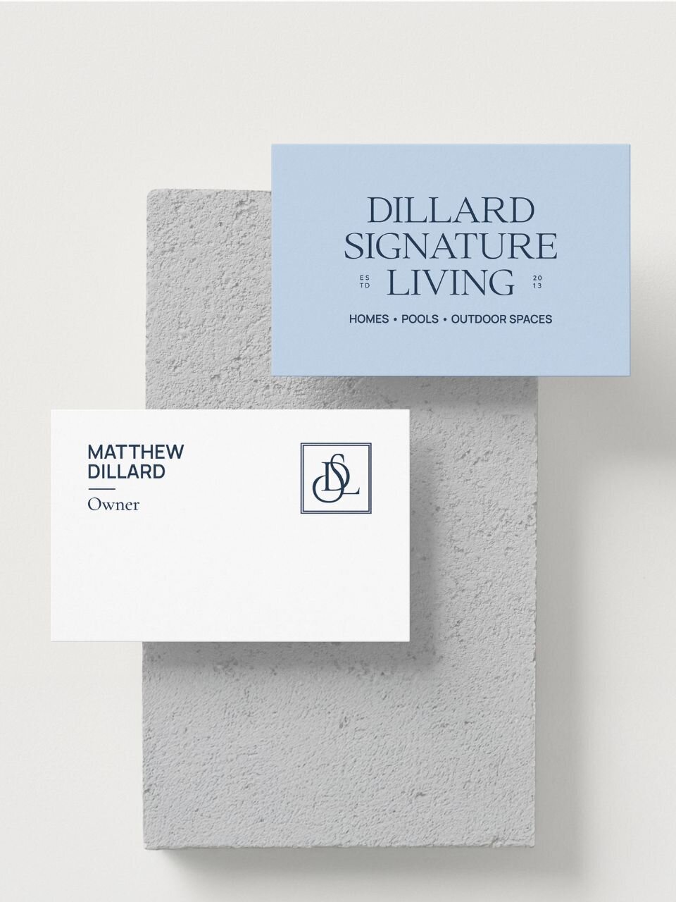 Minimalist business card designs for Dillard Signature Living, showcasing elegant typography and brand colors including sky blue, white, and sea navy.