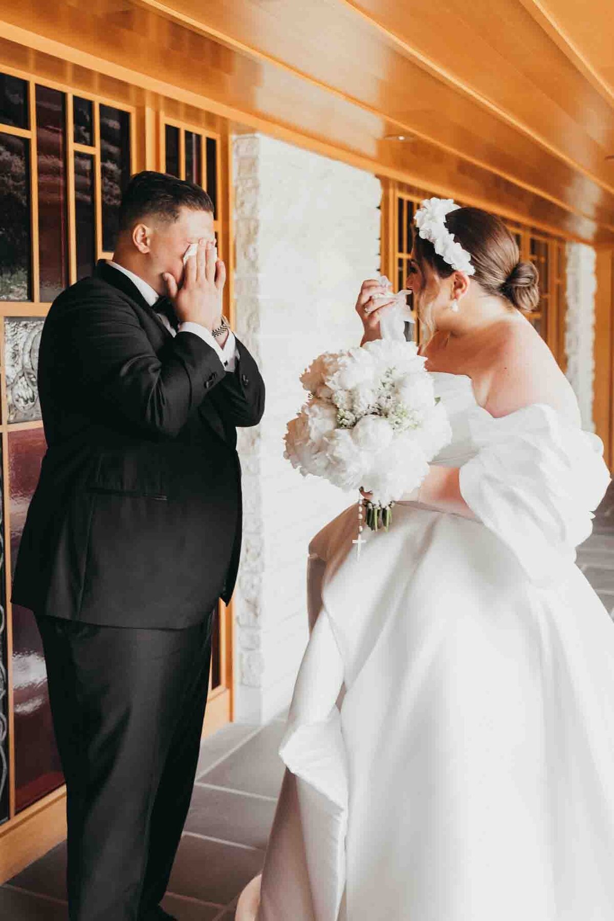 bride and groom have a sweet moment of tears during their first look together, moments before getting married.