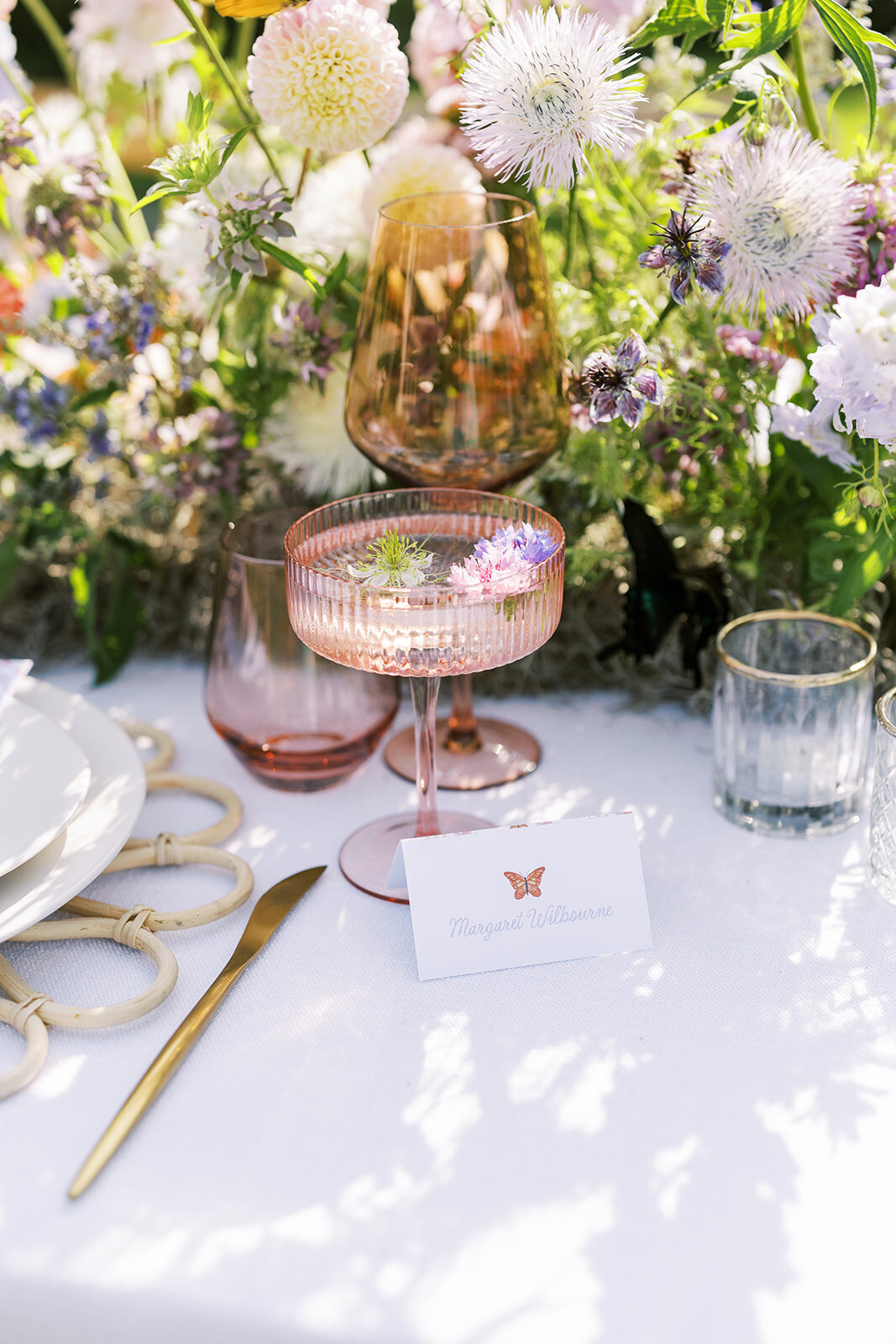 Whimsical garden party wedding reception table with handpainted watercolor butterfly by Dear Margo Designs with florals by Rooted Floral Designs