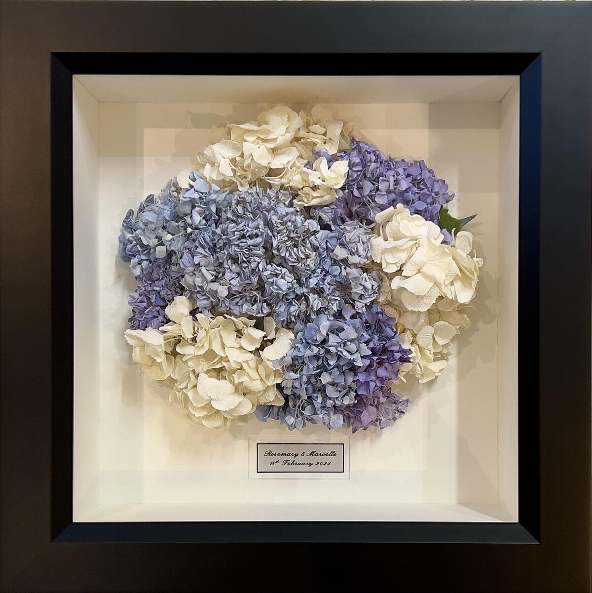 Wedding bouquet preserved in 3D frame.