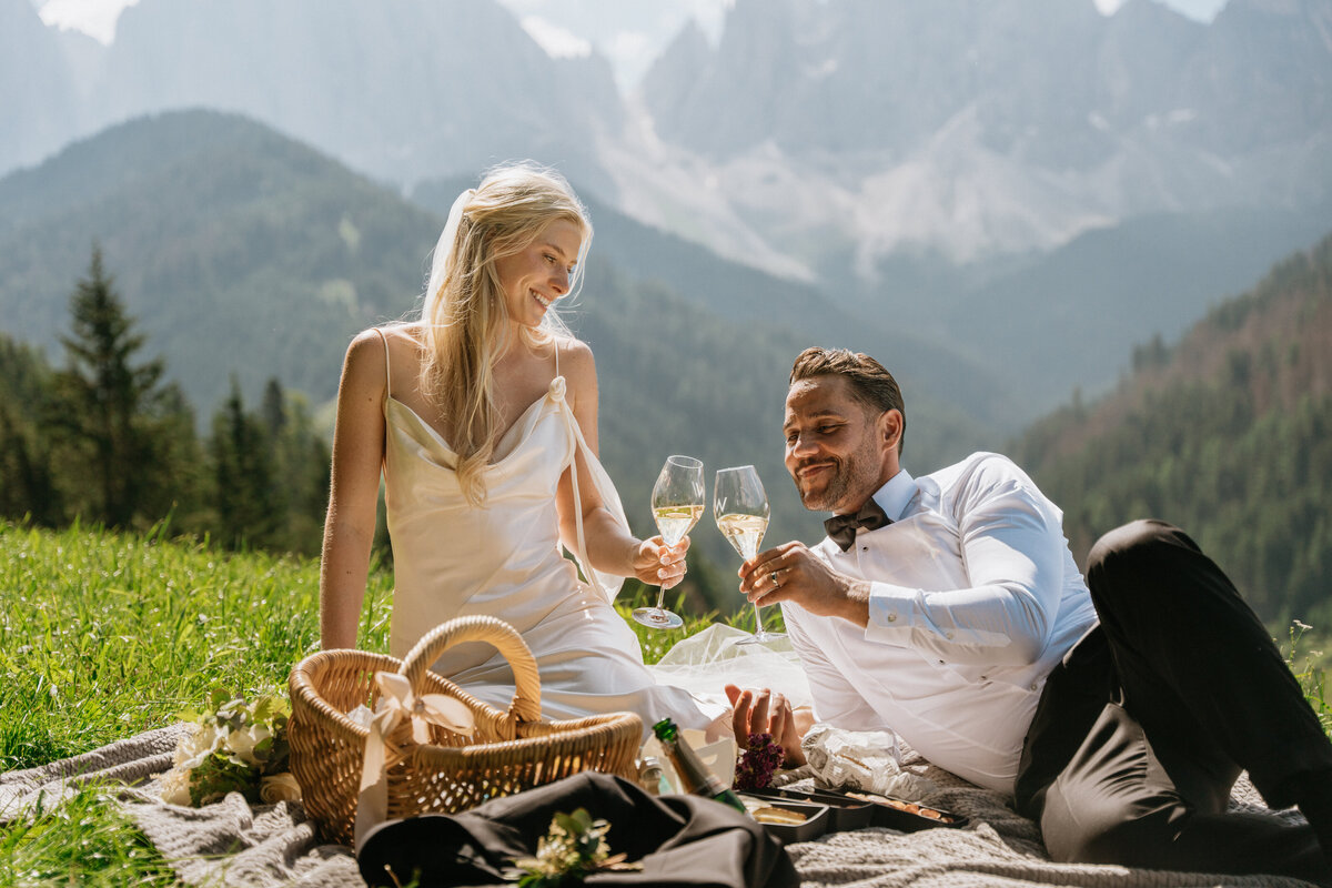 Bride smiling at groom during Dolomites picnic celebration