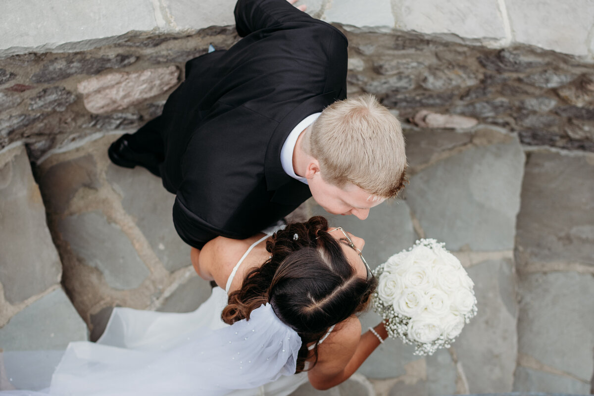bride and groom walking down the stairs at a beautiful home in St. Charles, IL by Moments by Meli