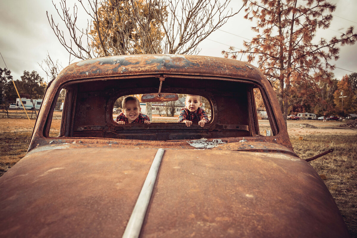 brothers portrait in vintage truck