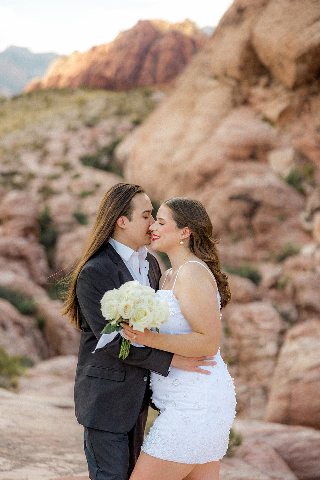 Engaged couple kissing at the Red Rock Canyon in Nevada