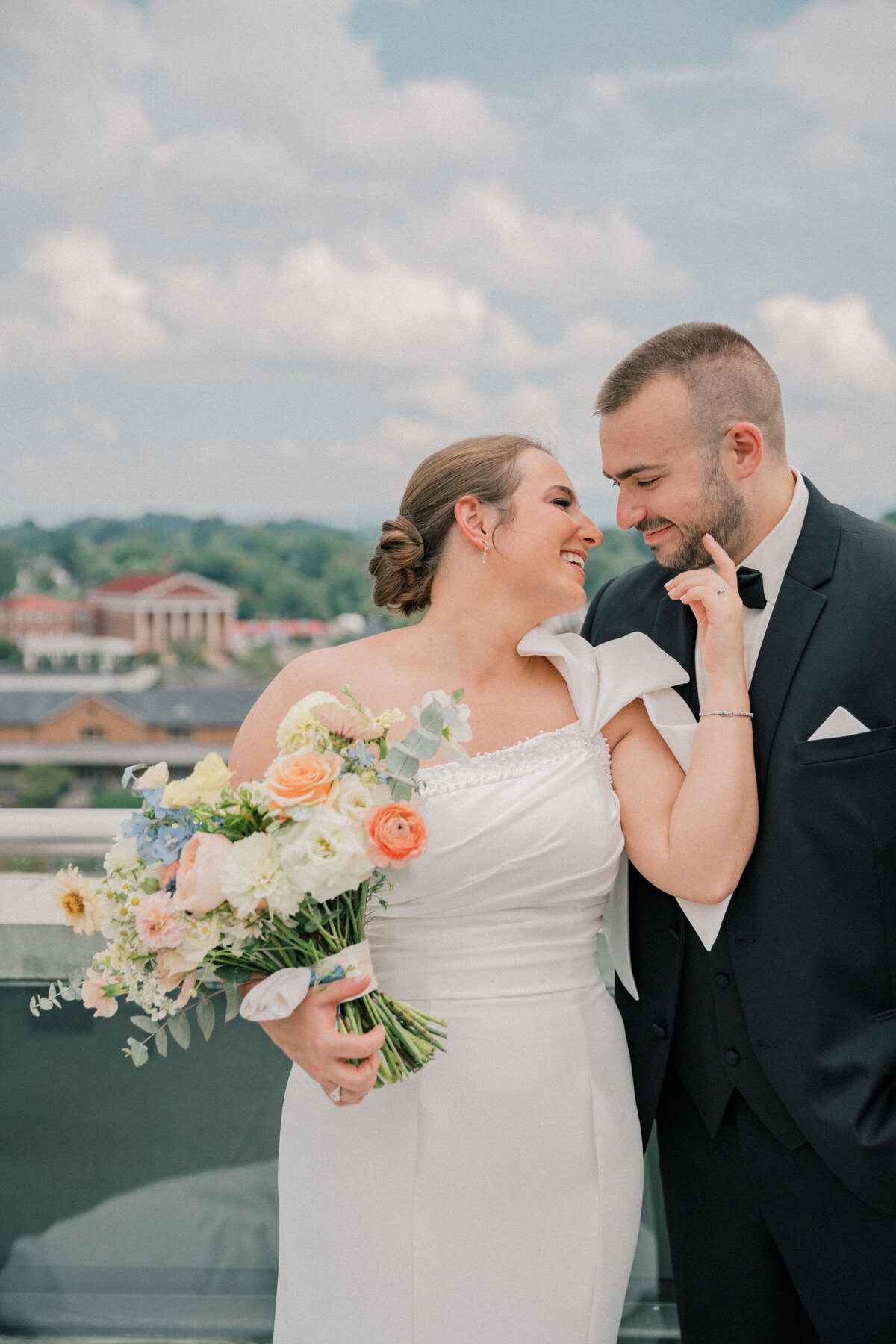 Elegant image of bride and groom on the rooftop of the Bristol Hotel before their Bristol Train Station wedding