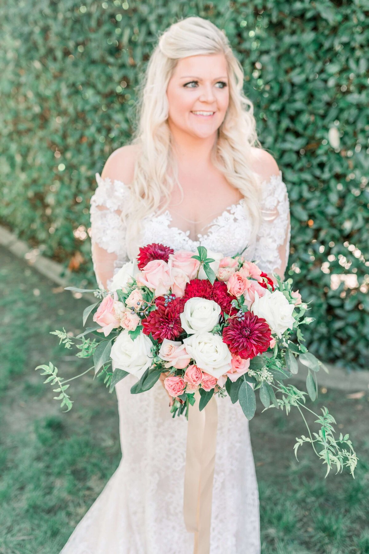 bride with a red bouquet