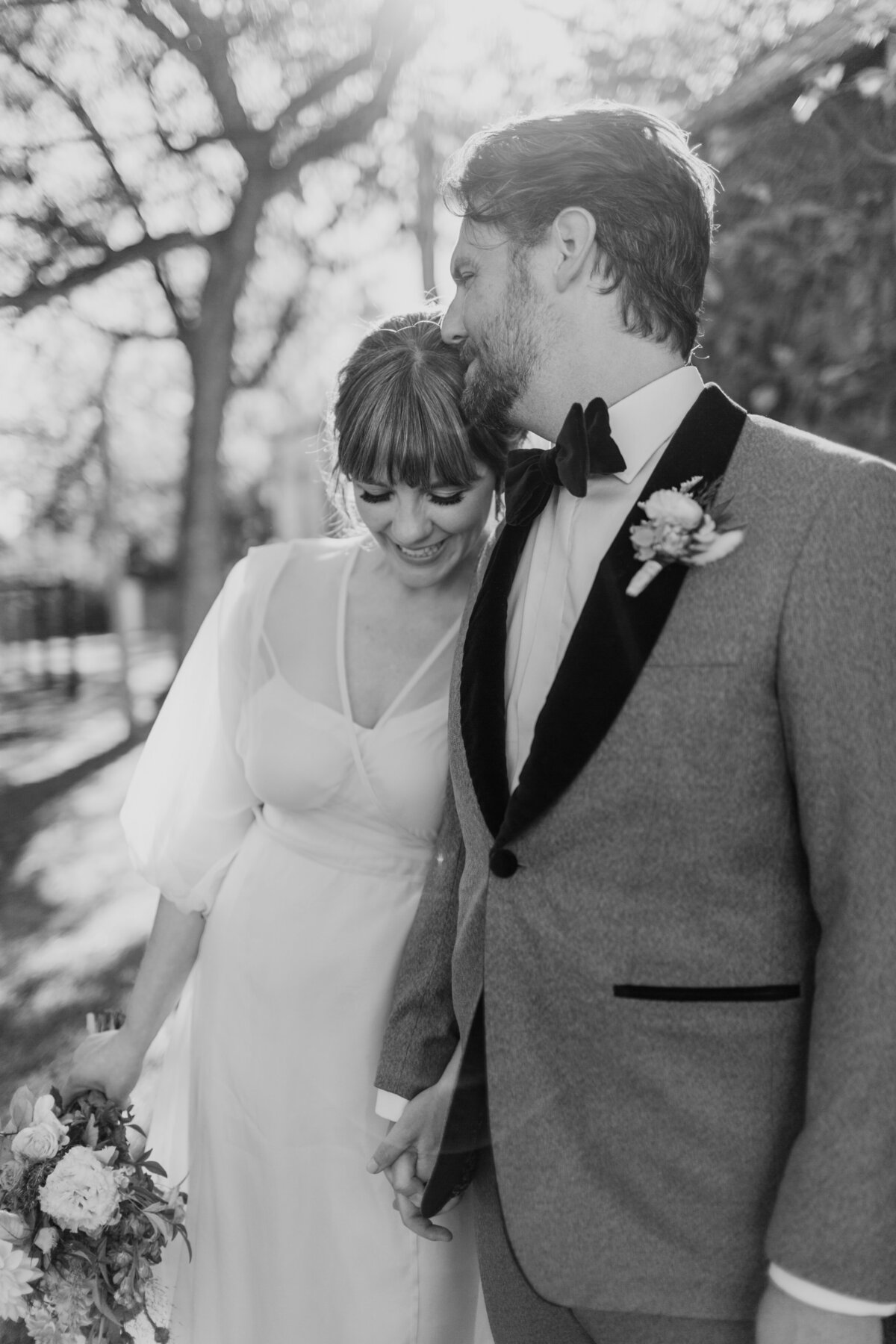 A sweet candid moment shared between a bride and groom captured by Fort Worth wedding photographer, Megan Christine Studio