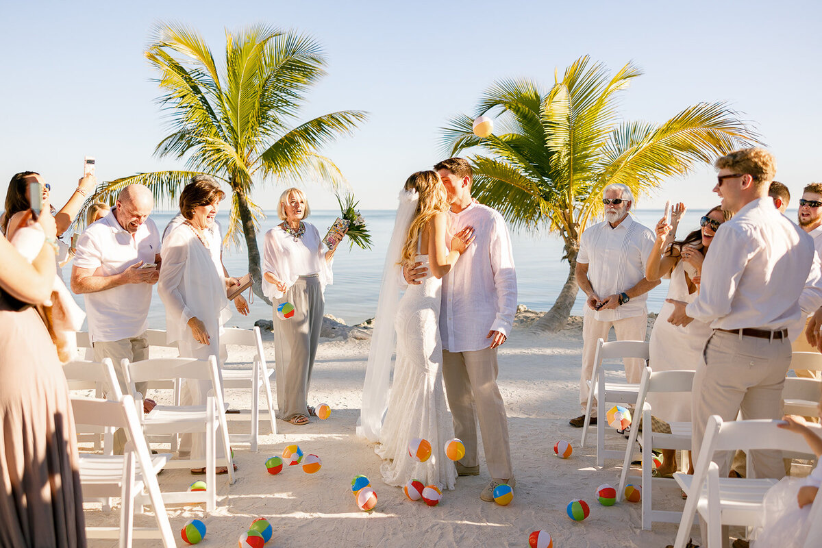  Laura and Abraham sharing their first kiss as husband and wife at their Miami destination wedding.