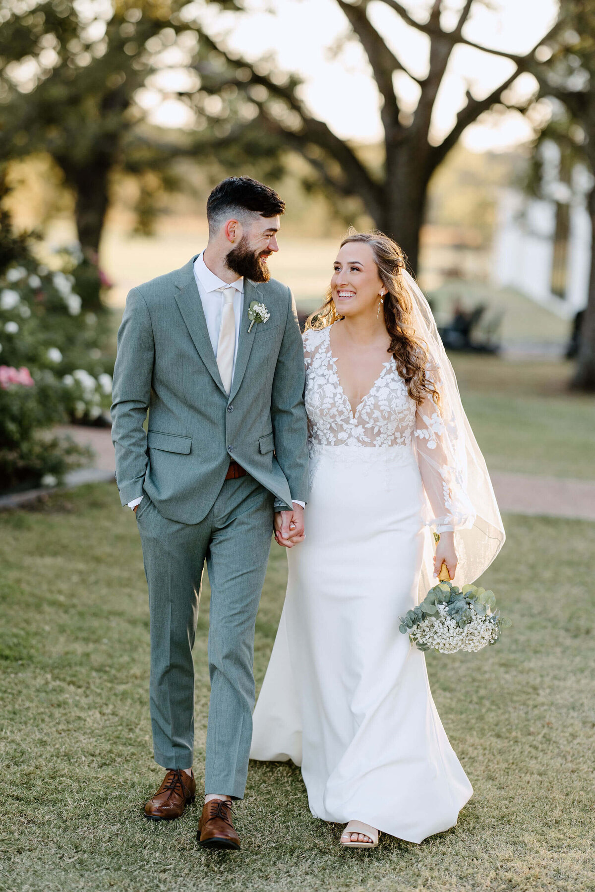 bride and groom walking and holding hands after wedding ceremony