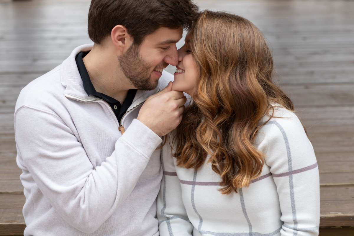 Toothy kiss of engaged couple