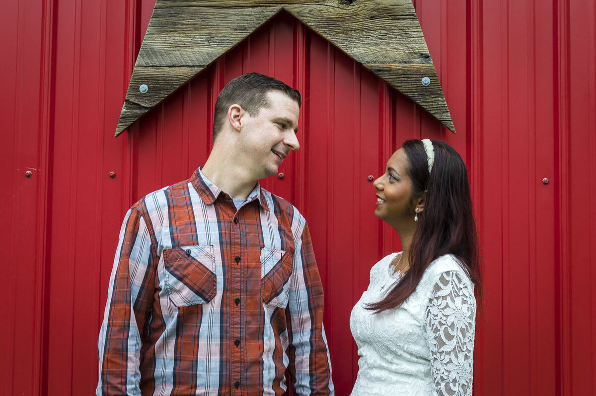 Couple gases at each other during their engagement session.