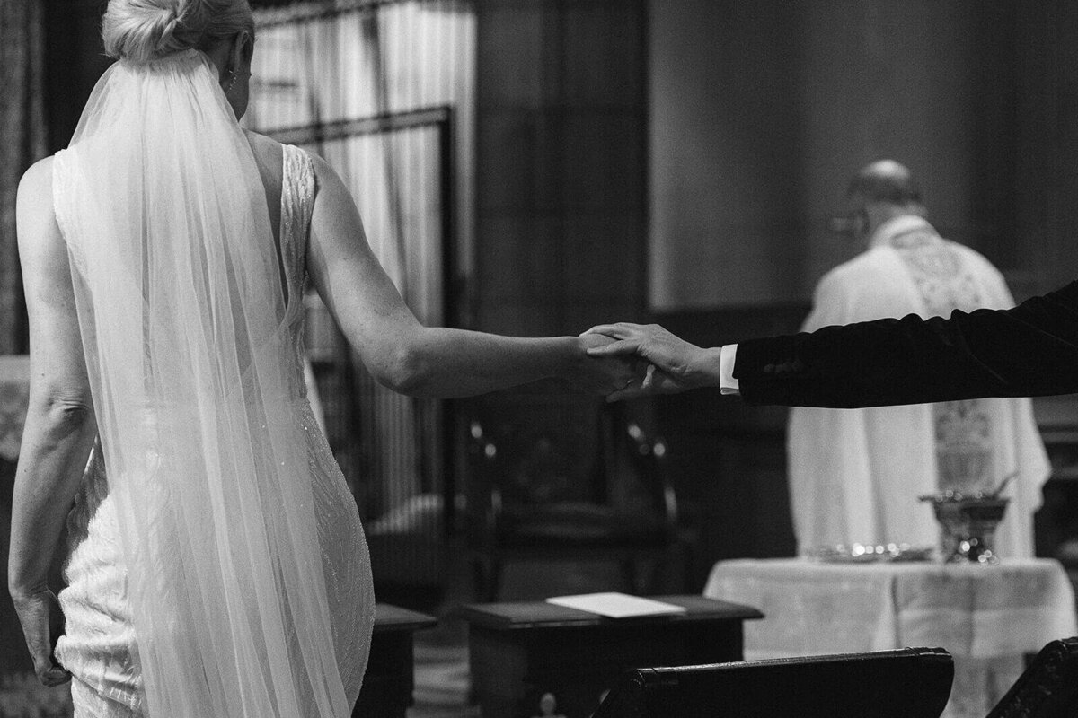A cathedral wedding Edinburgh as the couple have a Michelangelo moment with their hands