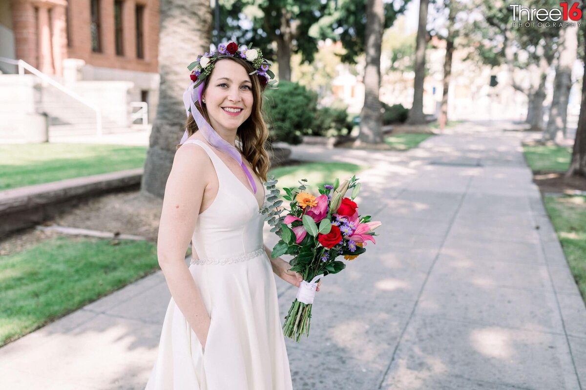 Bride to be poses with her bouquet of flowers