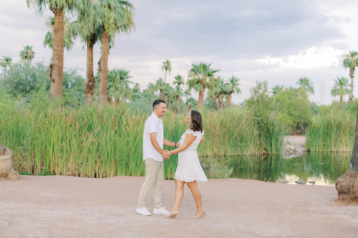 Capture the whimsy of your love with an engagement session at Papago Park in Scottsdale. This gallery features striking red rock formations, serene desert scenery, and playful moments that reflect the joy and excitement of your engagement