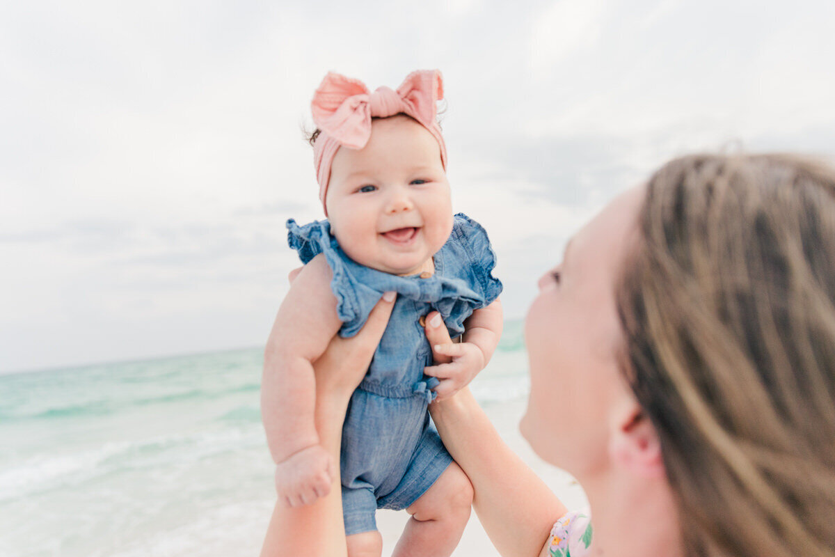 baby girl smiling on Pensacola Beach in vacation photos