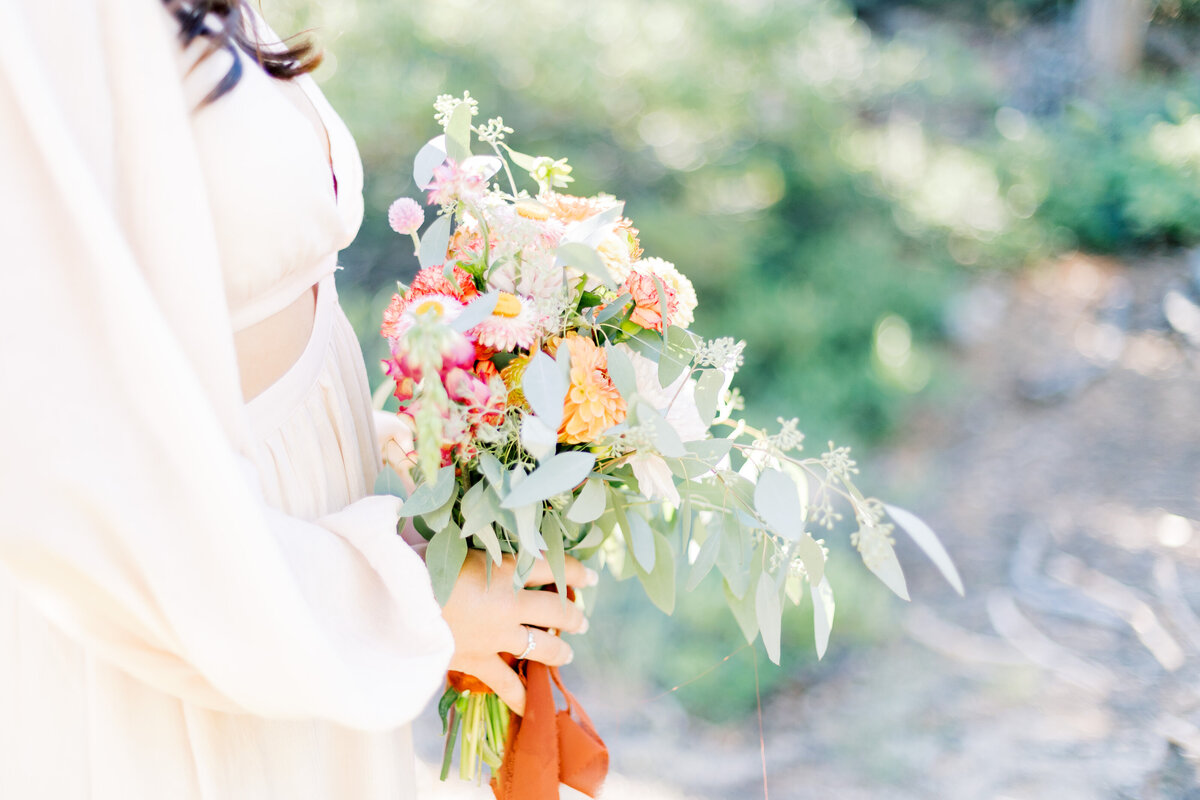 Bride holds wedding bouquet