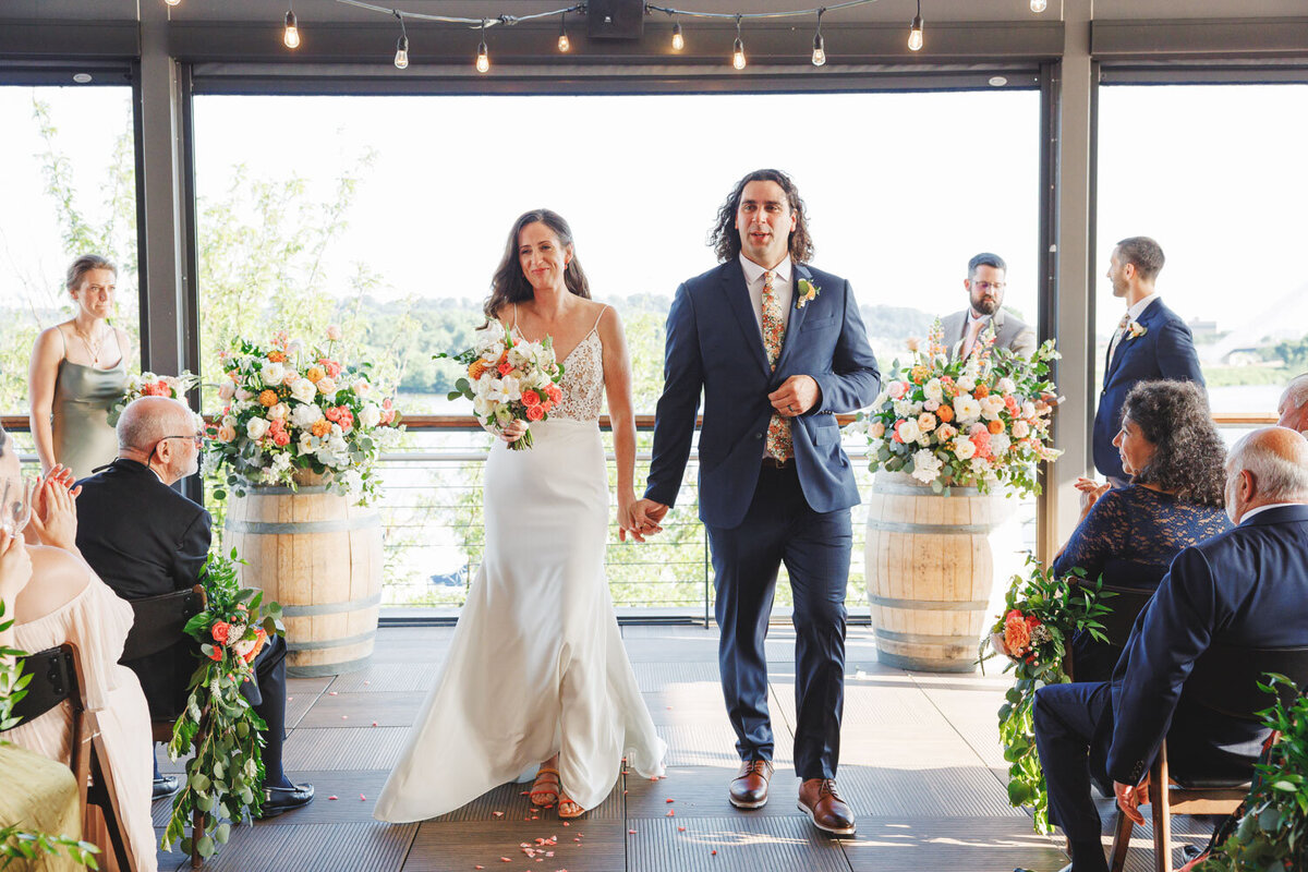 Bride and groom walking in the aisle
