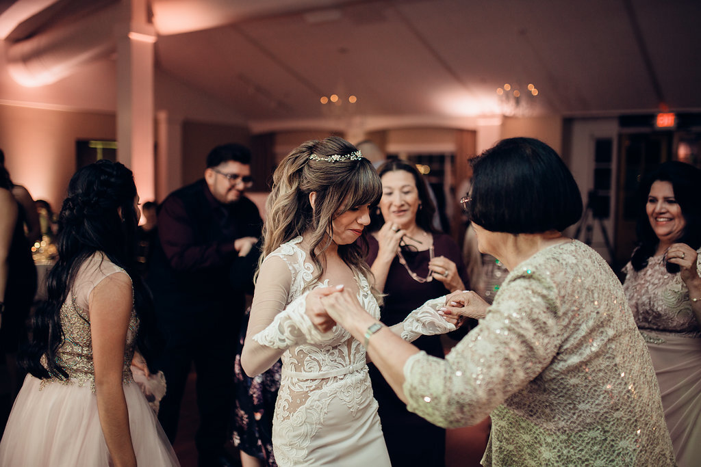 Wedding Photograph Of Bride In White Dress Dancing With a Woman Los Angeles