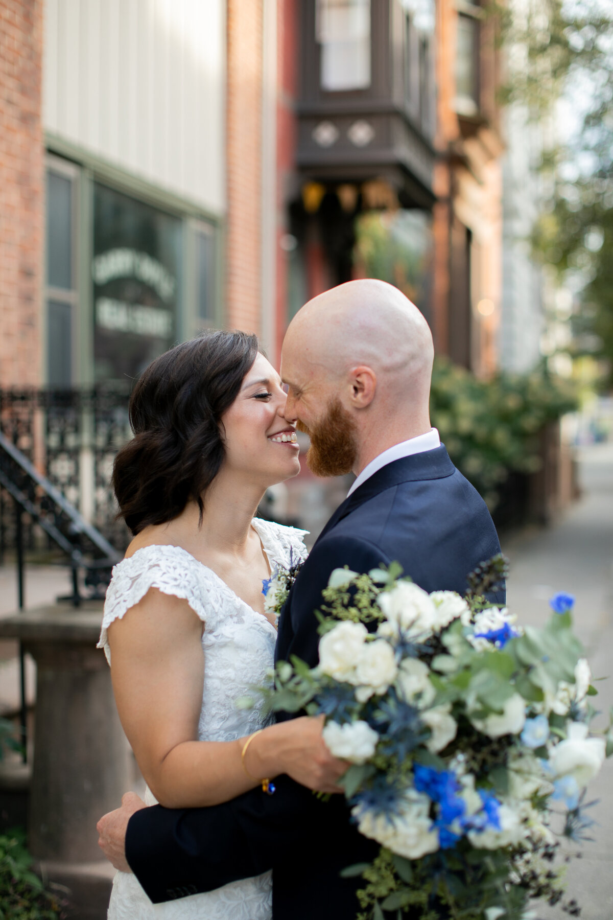 Bride and groom smile at each other