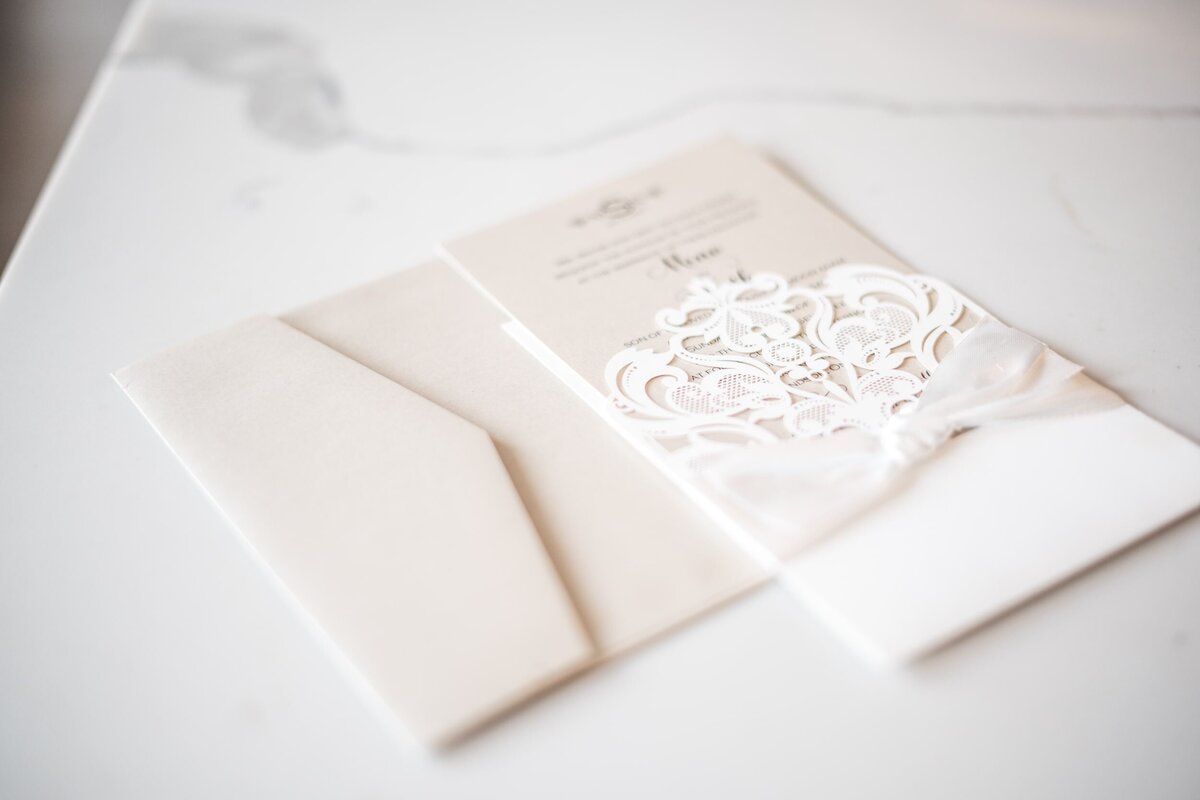 delicate laser cut wedding invitation