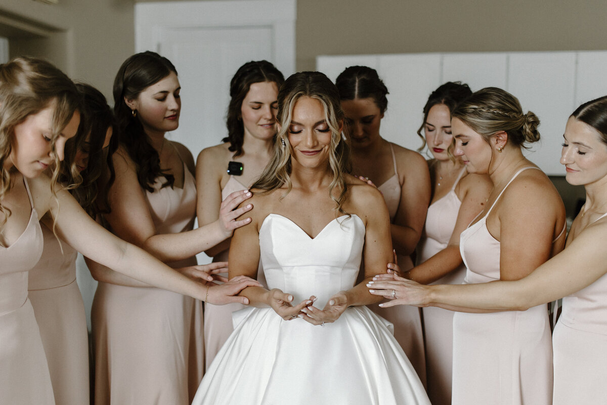bridesmaids praying before Catholic wedding