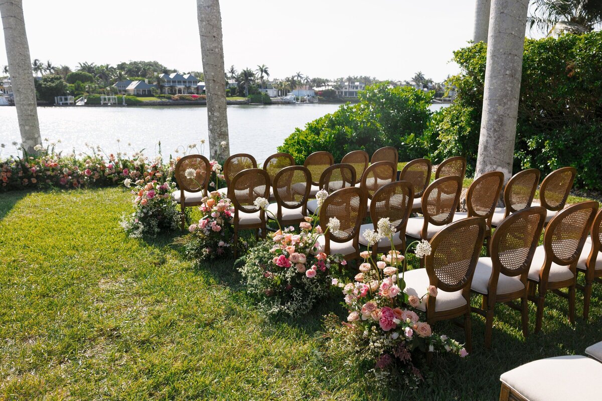 Scenic outdoor walkway lined with flowers by the water at Port Royal, captured by a wedding photographer in Miami, FL.