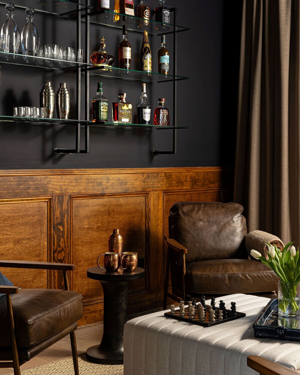 liquor lounge with wood paneling accents