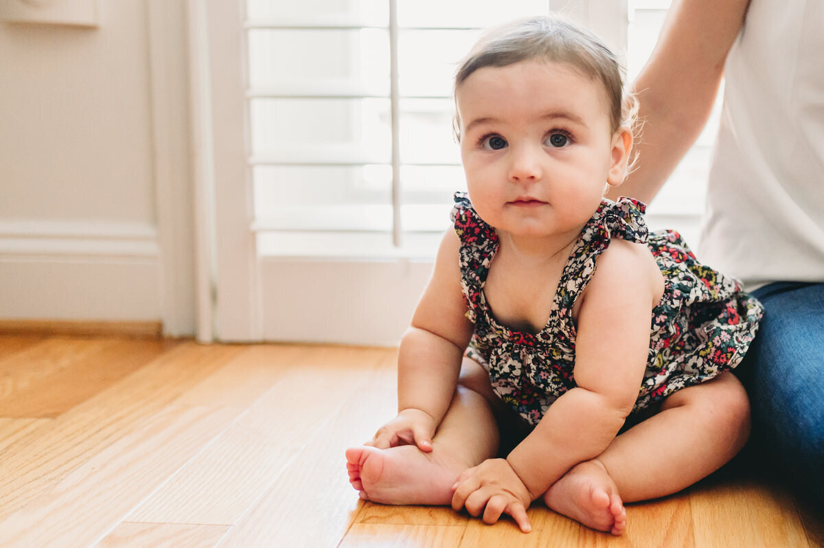 baby sitting on floor