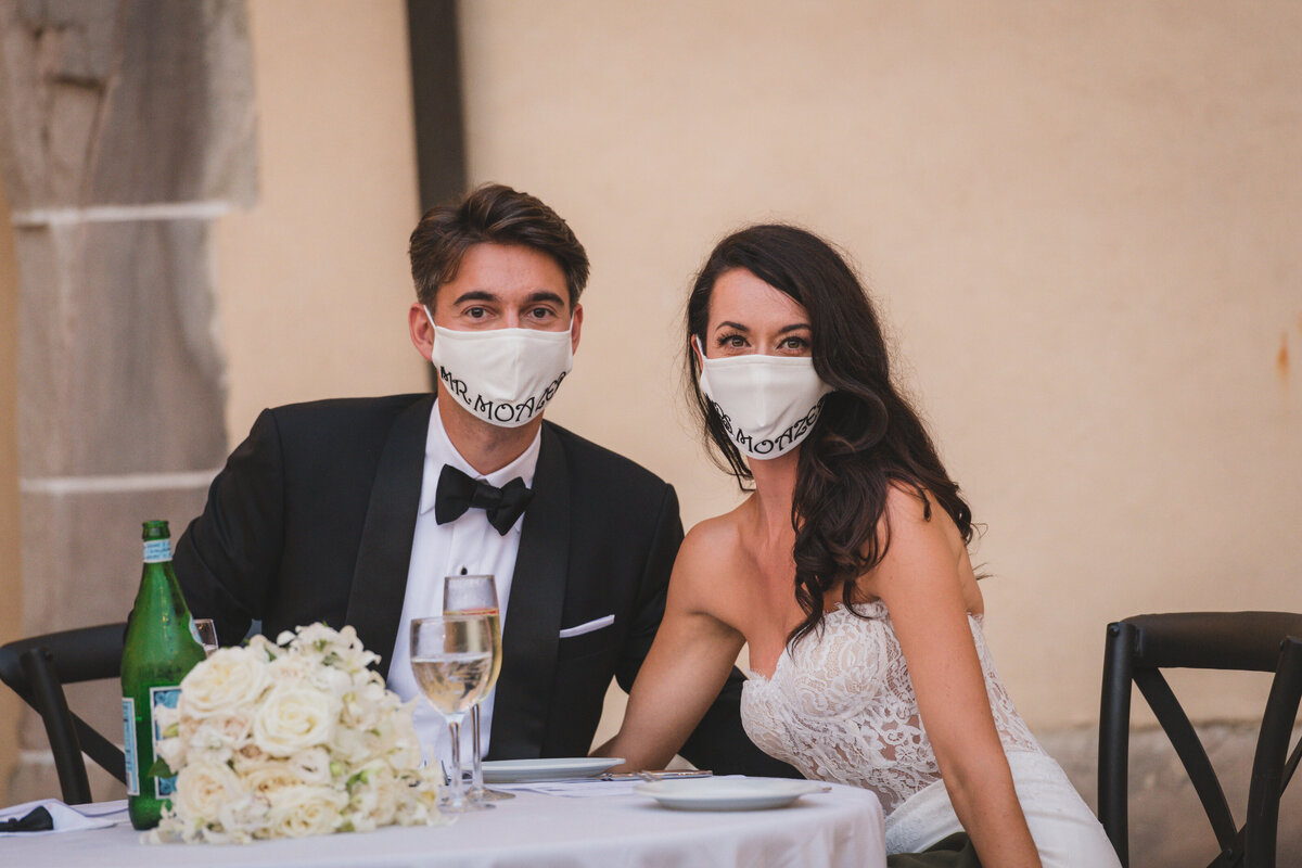 bride and groom wearing their masks at Oheka Castle