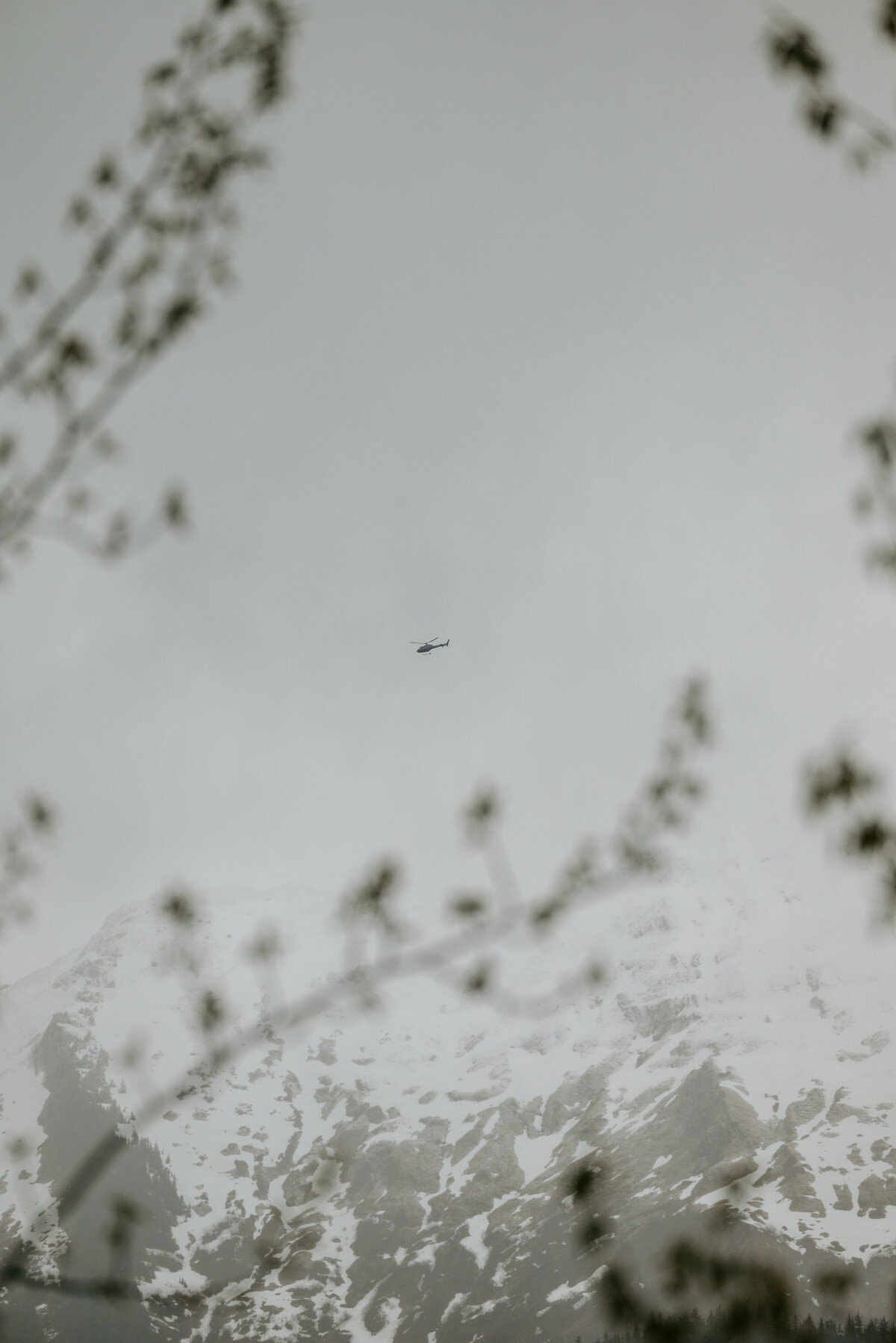 helicopter fly over the mountain