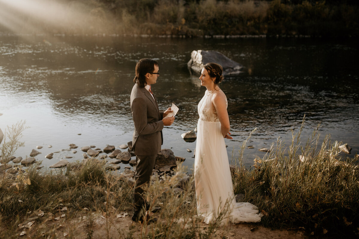 bride and groom saying vows by the Rio Grande river
