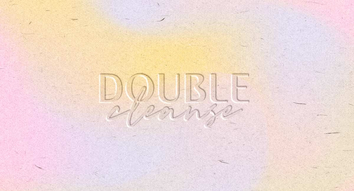 A pastel gradient design featuring the words "Double Cleanse" in sleek, embossed typography. The soft blend of yellow, pink, and purple tones creates a calming and refreshing aesthetic, reflecting the brand’s focus on gentle skincare.